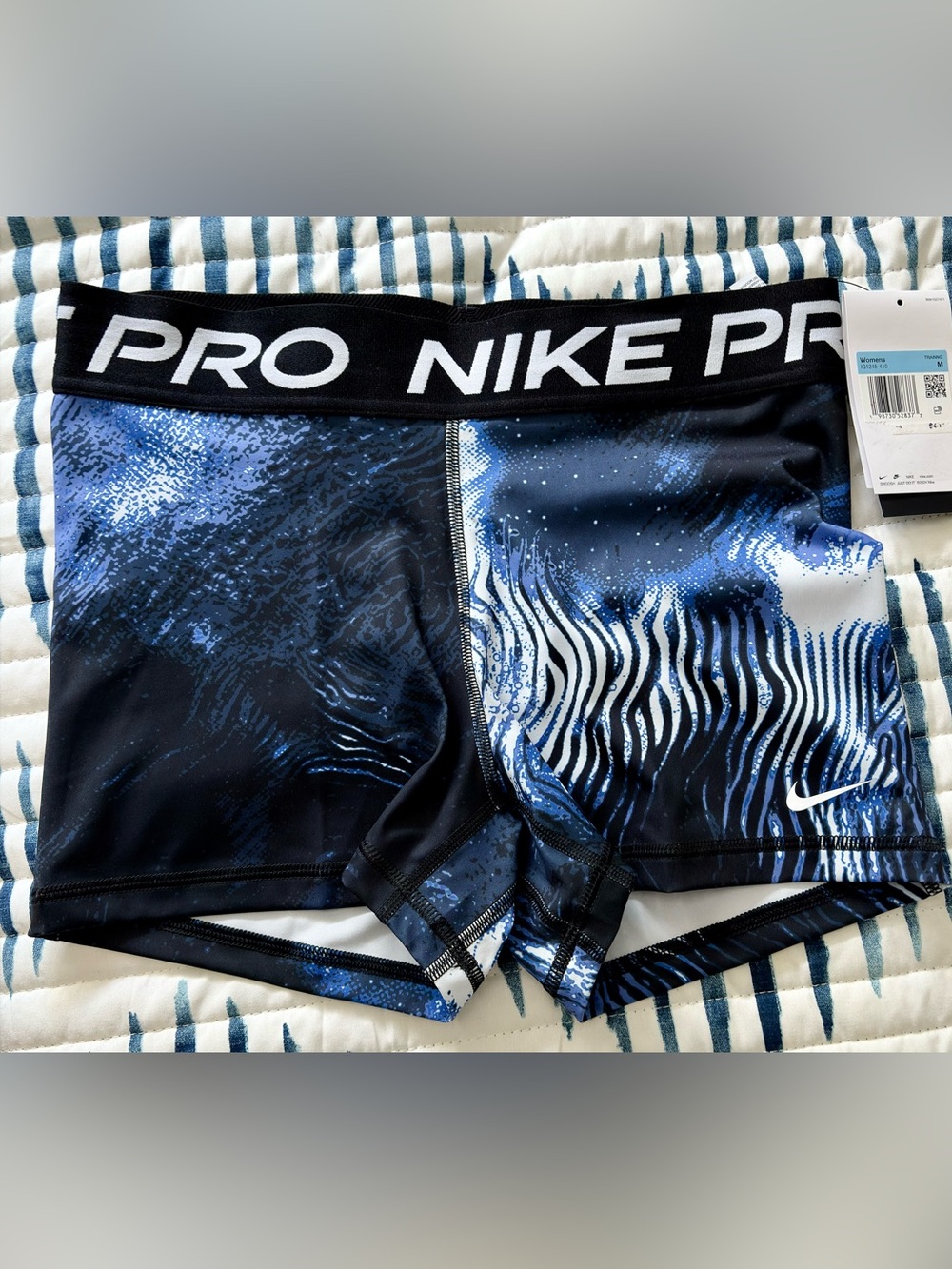 Nike women’s athletic running shorts in Blue and Black Wave Print